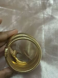 Elegant Gold Tone Coil Watch with Blue Dial