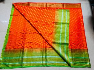 Vibrant Orange Silk Saree with Green Border