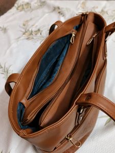 "Carry your essentials in style with this Handbag"
