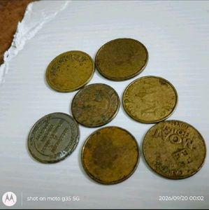set of 7 used vintage Collectible tokens