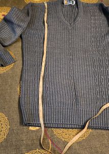 Gray V-Neck Knit Sweater and curtain