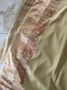 Elegant Golden Saree with Paisley Border