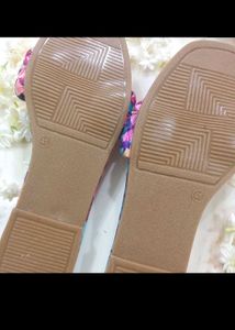 multicolored textured flats