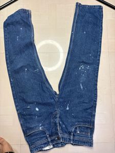 Stylish Blue Jeans with Paint Splatter Detail