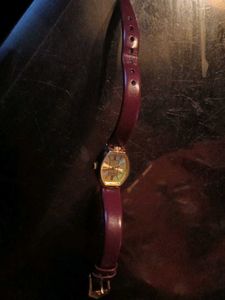 Elegant Gold Tone Watch with Burgundy Band