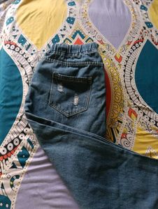 Distressed Blue Denim Jeans