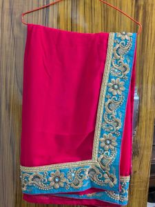 Elegant Red Saree with Green  Embroidery