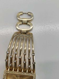 Elegant Gold Tone Watch with Rhinestones