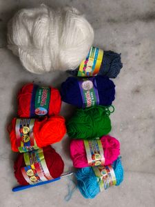 Assorted Yarn Balls and Crochet Hook