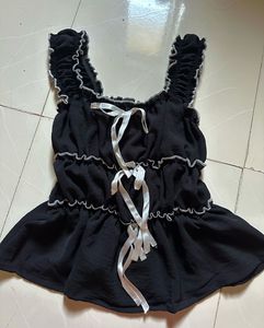 Chic Black Peplum Top with Ribbon