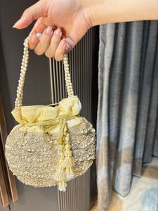 Elegant Gold Embellished Clutch