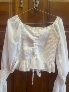 Chic White Smocked Blouse with Bell Sleeves