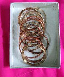 Orange And Golden Colour Bangles