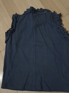 Chic Sleeveless Top with Ruffle Neckline