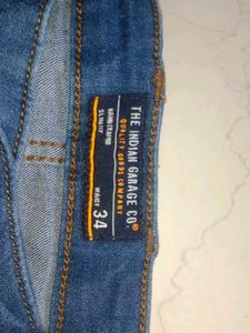 Stylish Men's Ripped Blue Jeans branded with tag