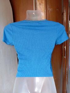 Blue Ribbed Lettuce Hem Top