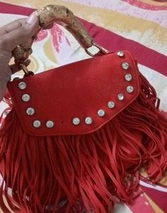 Chic Red Handbag with Gold Accent Handle