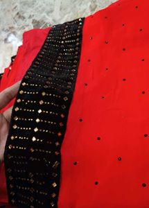Elegant Red Saree with Black Embellished Border