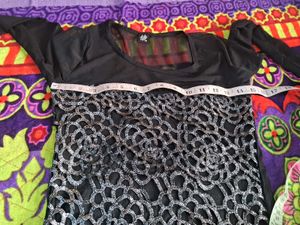 Elegant Sheer Black Top with Silver Detail