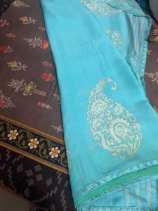 Elegant Teal Saree with Intricate Design
