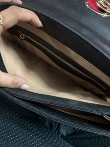 Chic Black Handbag with Gold G Logo