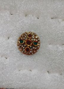 golden ring with Red and green stone