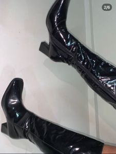 Knee length glossy boots