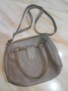 Grey sling bag