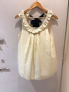 Chic Cream Ruffled Top with Bow Detail