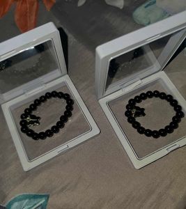 Set of Black Beaded Bracelets with Charms