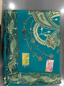 Elegant Teal Saree with Gold Embellishments