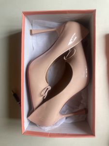 Elegant Nude Patent Bow Pumps