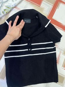a sweater top - half sleeves - in new condition