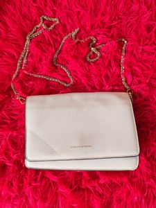 Chic Cream Crossbody Bag with Gold Chain
