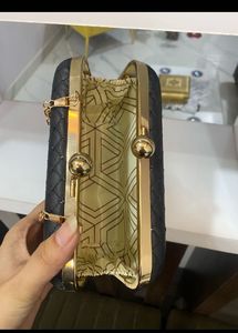Elegant Black Quilted Clutch Bag with Gold Chain