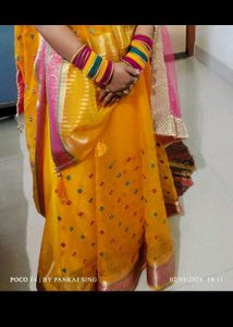 Vibrant Yellow Saree with Multi-Color Bangles