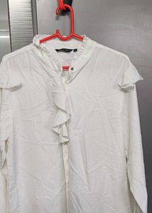 Chic White Ruffle Front Top of westside brand