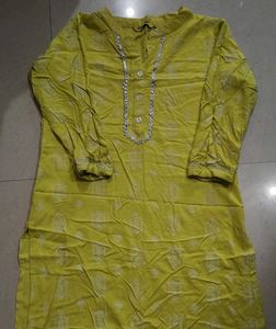 Stylish Yellow Kurti with Silver Embellishments