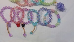 Set of Beaded Bracelets with Charms