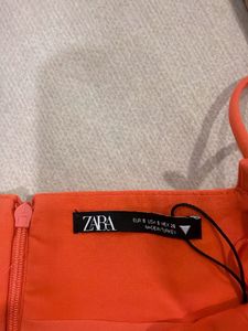 Vibrant Orange Cut-Out Top with pants