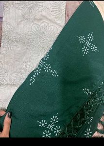 Elegant Green Silk Saree with Pearl Necklace