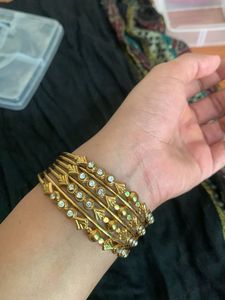 Elegant Gold Tone Bangles with Stones