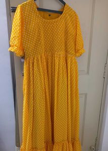 yellow long frockwith white dots