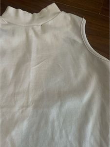 White fitted high-neck sleeveless top