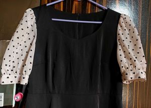 Chic Black Dress with Heart Print Sleeves