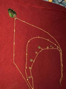 Gold Tone Layered Necklace with Green Leaf Pendant