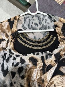Chic Animal Print Top with Embellished Neckline