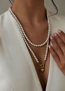 Elegant Pearl Necklace with Gold Heart Charm