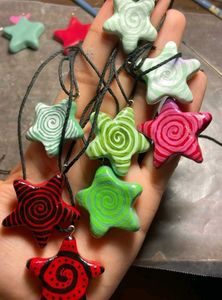 Hypnotic Swirl Star Necklaces