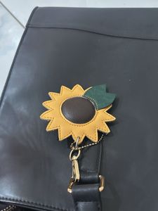 Chic Black Tote Bag with Sunflower Charm